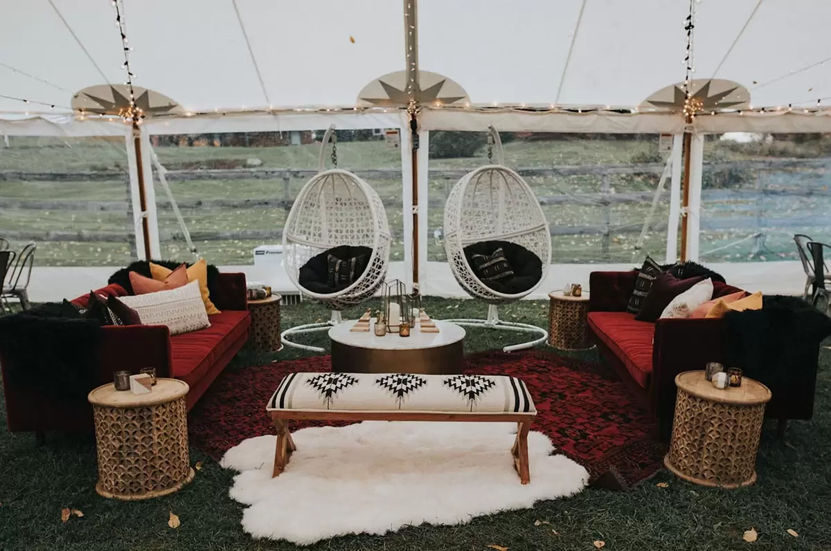 dramatic velvet couches at trendy wedding