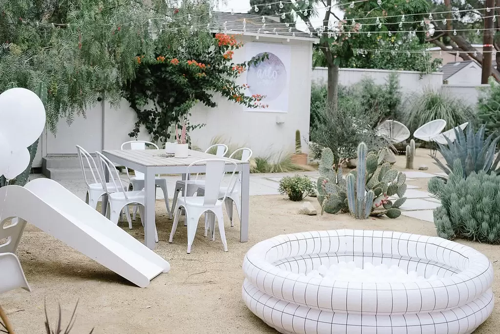 monochromatic baby play area at sky themed first birthday party