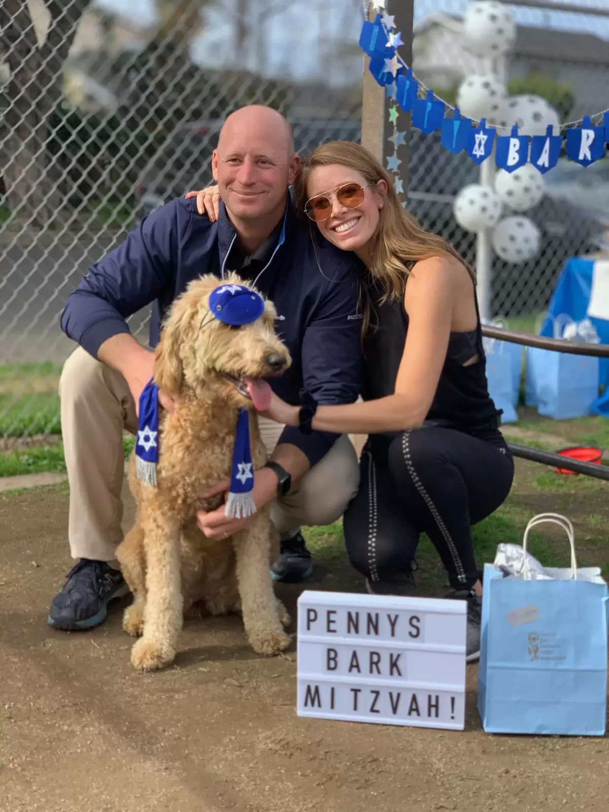 Penny and her proud parents at her Bark Mitzvah