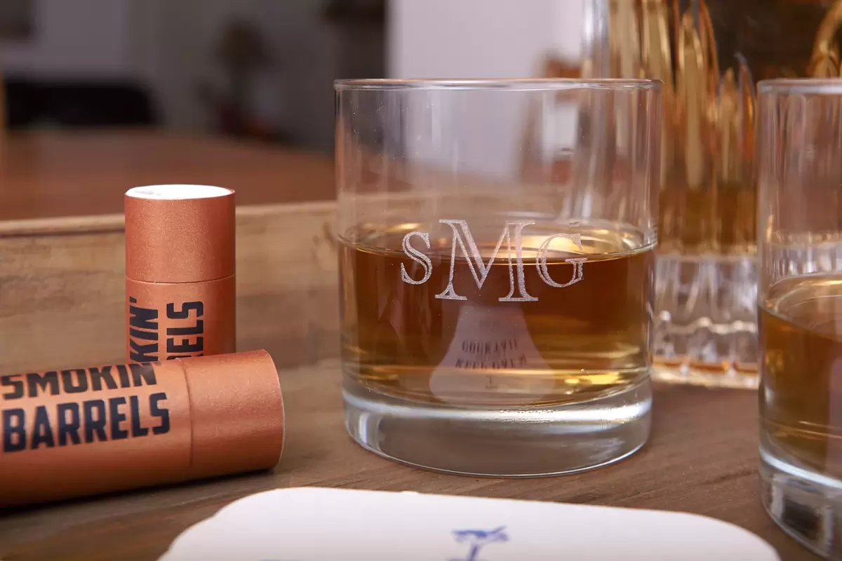 give Dad an engraved rocks glass or cigar matches from For Your Party