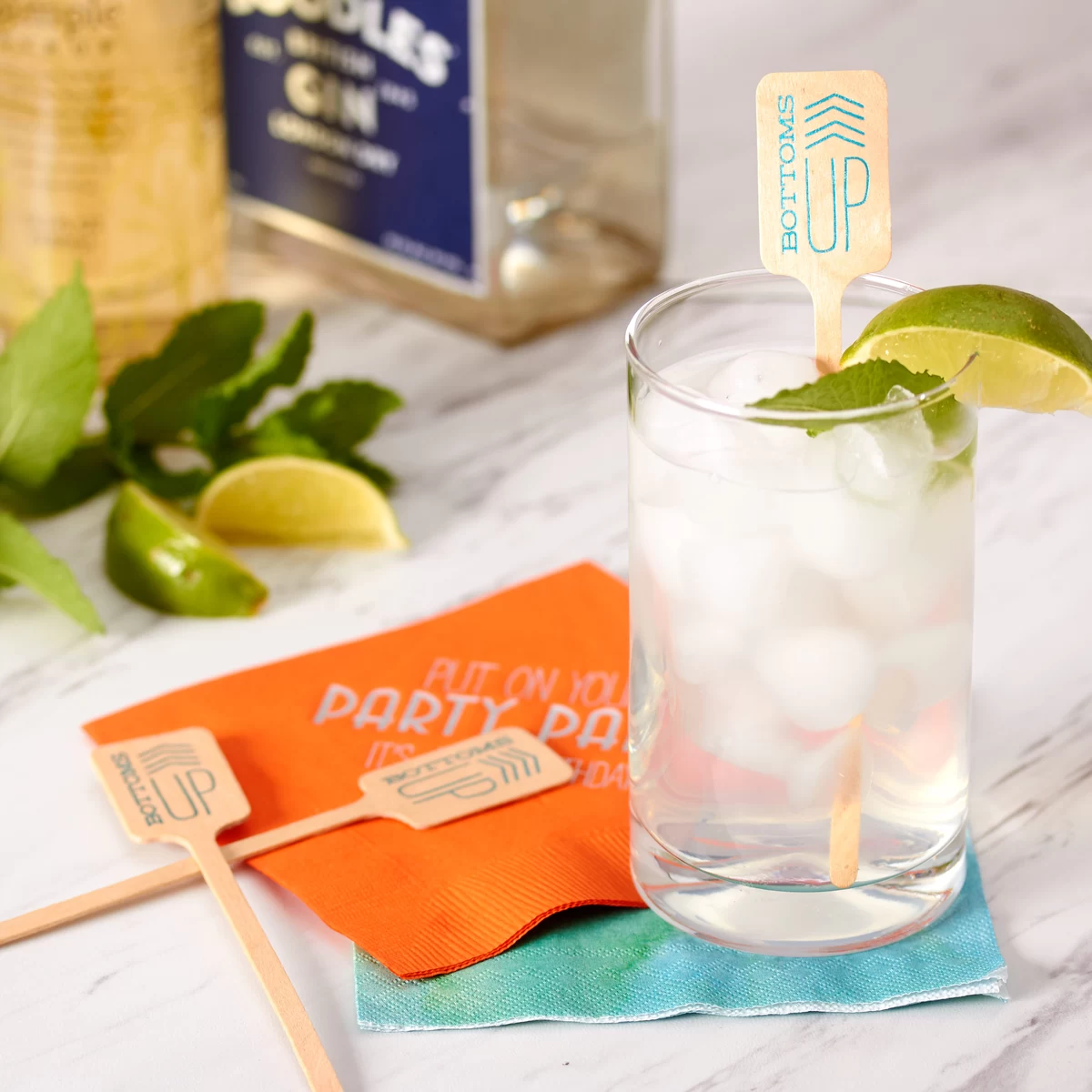 chinatown rickey with personalized cocktail napkin and custom drink stirrer bottoms up