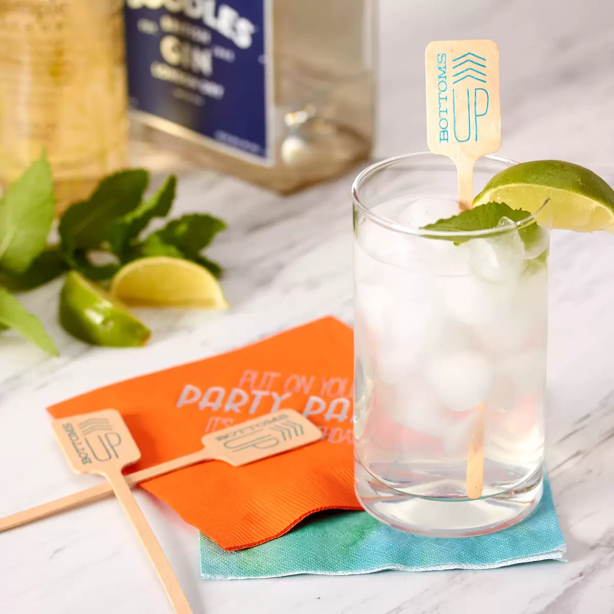 chinatown rickey with personalized cocktail napkin and custom drink stirrer bottoms up