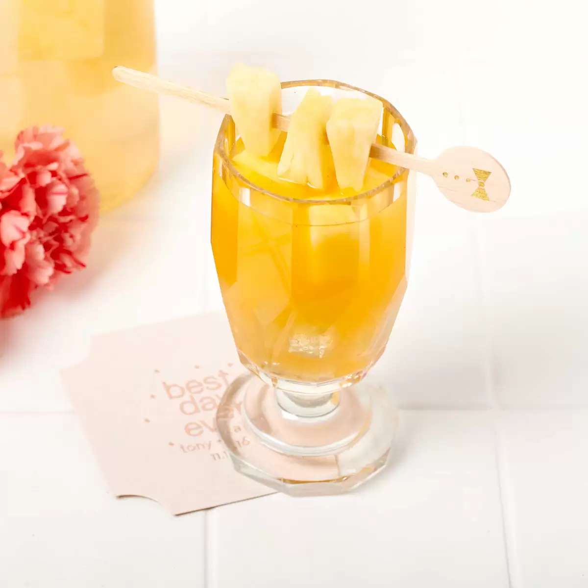 Pineapple Rum Punch cocktail with personalized drink stirrer