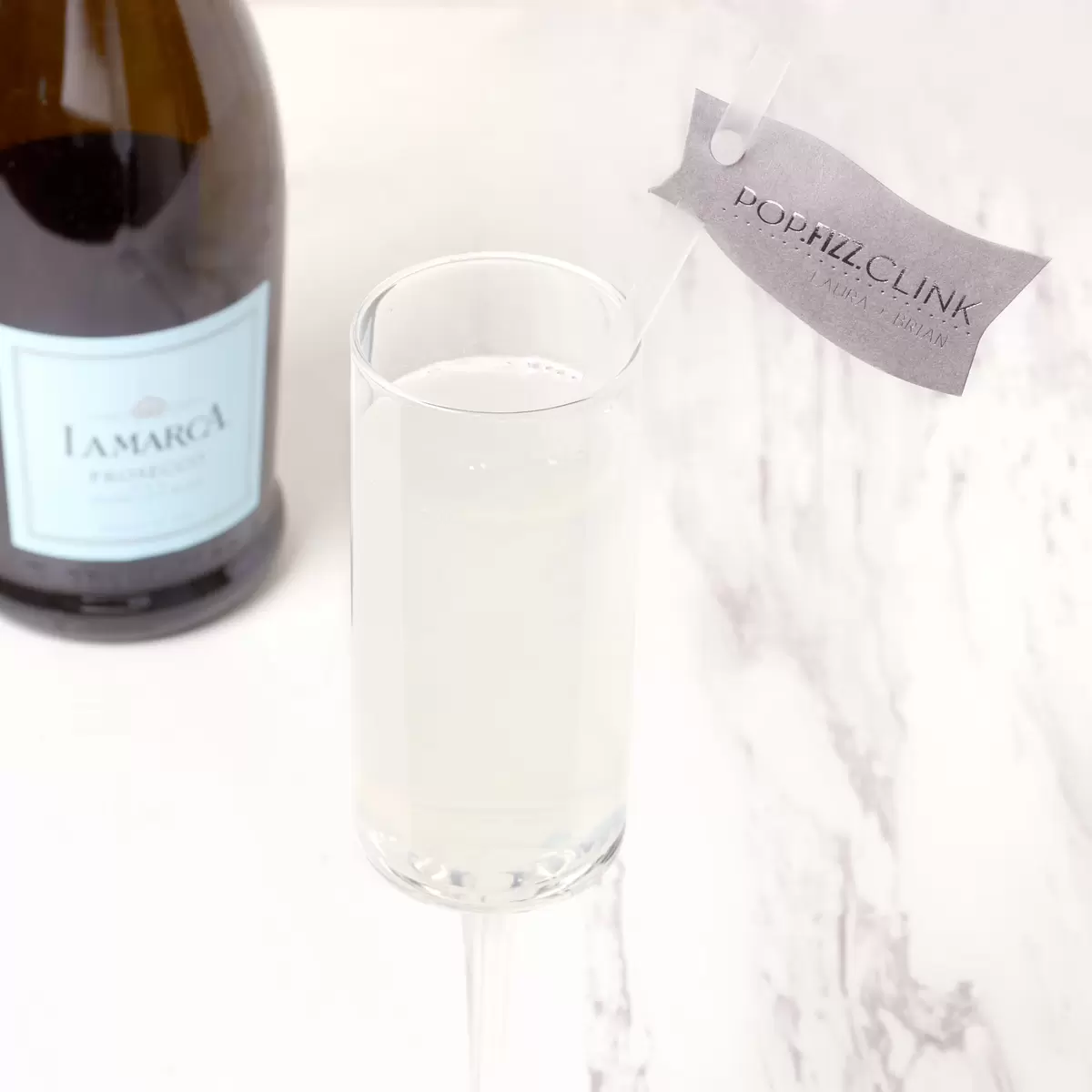 Elderflower, Prosecco and Gin with a personalized straw flag